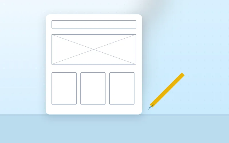 A designer sketches a page layout grid on paper with a pen beside a tablet.
