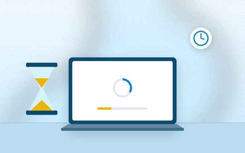 A business owner taps her fingers on the desk while a laptop page keeps loading.