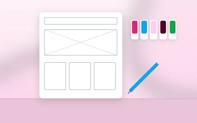 A designer uses a ruler and pen to plan a structured website grid system on paper